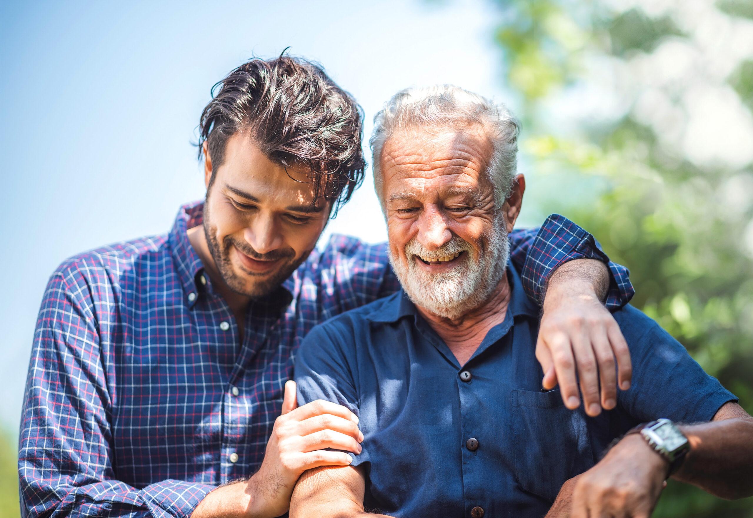 Adult hipster son fun hugging old senior father at home, two generations have a beard talking together and relaxing with smile, 2 man happy enjoy to living at home in father's day with love of family